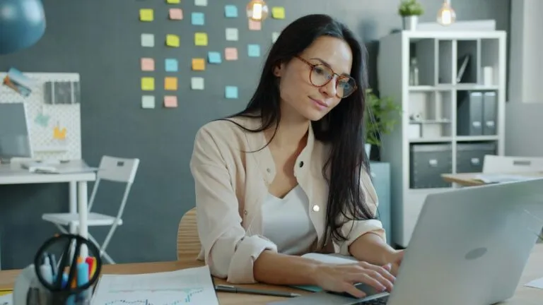 Consultant arranging appointment materials beside a laptop and headset