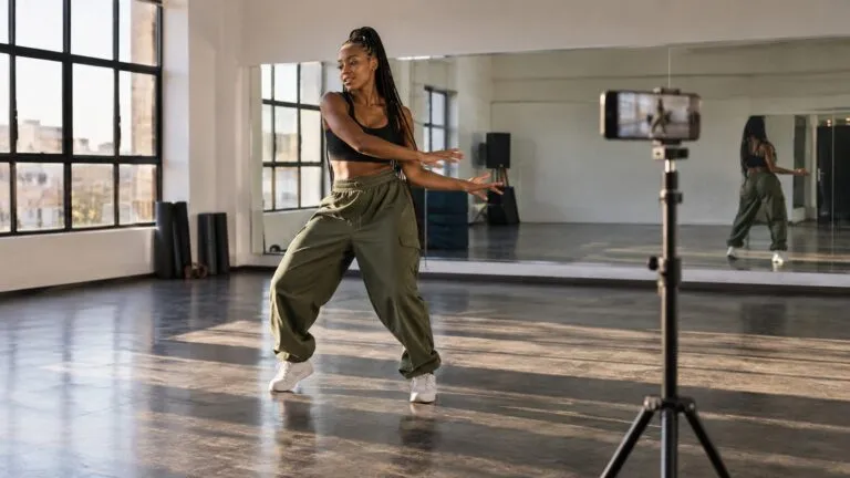A South African creator recording a dance lesson for a paid audience