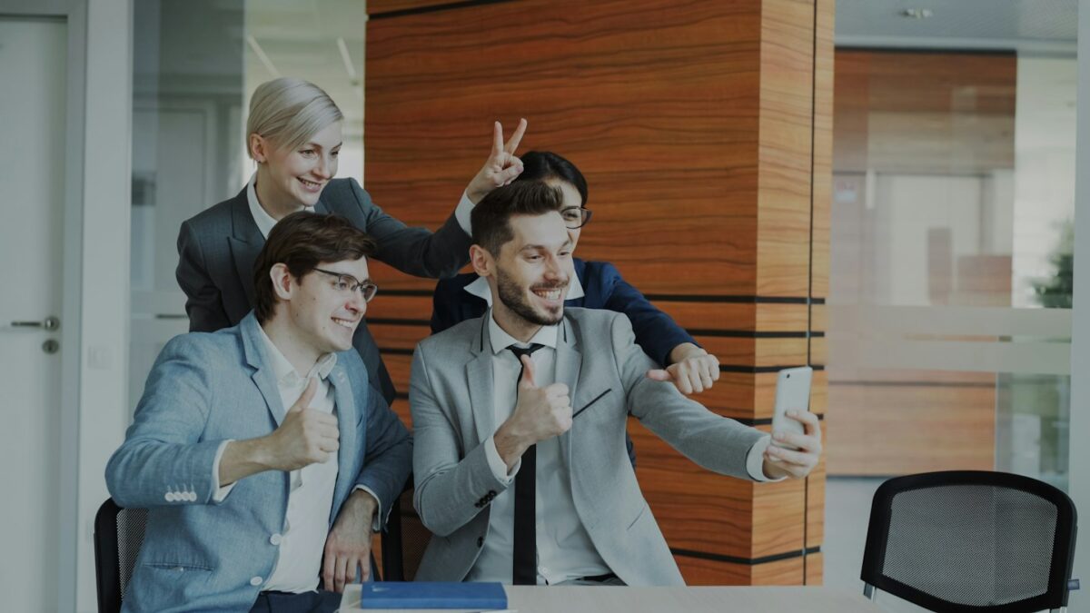 Colleagues taking a selfie in the office